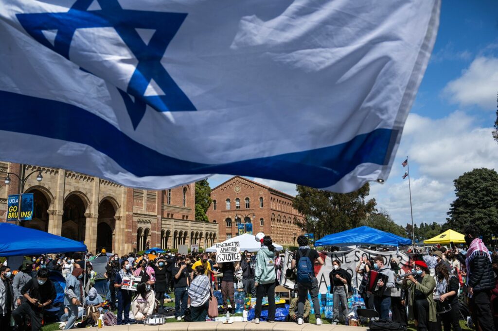 Jewish students wave Israeli flags as a counter-protest near a pro-Palestinian camp at the University of California, Los Angeles on April 25. Sarah Reingewirtz/MediaNews Group/Los Angeles Daily News/Getty Images