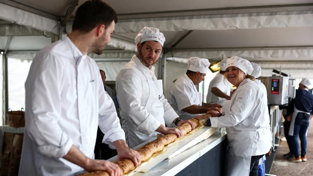 The world’s longest baguette being made in Suresnes near Paris, France on Sunday. Photo: Reuters